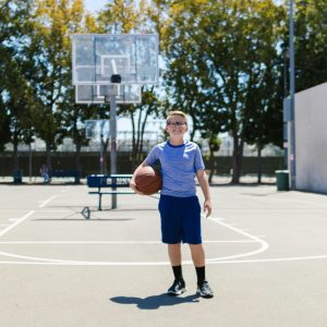 kid playing basket ball